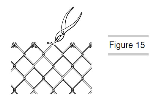 A scissor is removing excess chain link fence fabric.