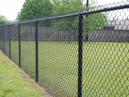 Several pieces of chain link fencings are installed on the grassland.