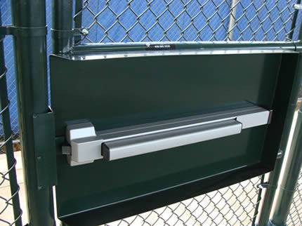 A powder coated chain link fence gate with panic bar.